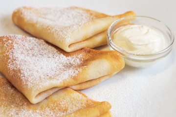 Crepes with cream and sugar