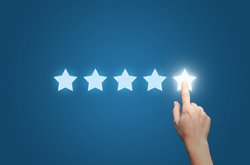 Businesswoman pointing five star to increase - obrazy, fototapety, plakaty