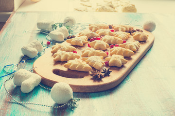 Festive cookies in the shape of Christmas trees and stars