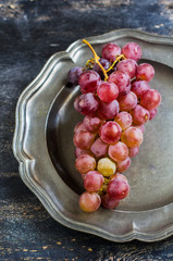 Organic grape on rustic background
