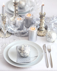 White & silver christmas table setting
