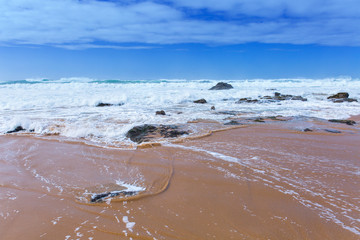 View of Guincho Beach, Cascais, Portugal. Empty beach. No people. Beauty in nature. Waves on the Atlantic ocean. Beautiful landscape.