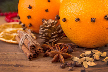 Ingredients for mulled wine over on wooden table.