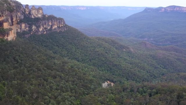 Aerial view of Three Sisters rock formation and The Orphan Rock in the Jamison Valley in the Blue Mountains in New South Wales, Australia.