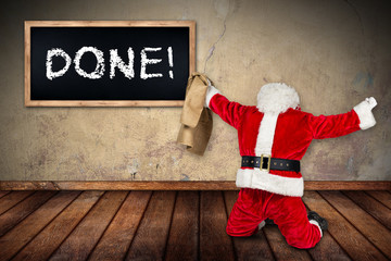 classic red white Santa Claus with empty bag celebrating on his knees the work is done ready for...