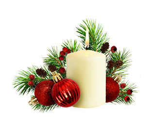 Christmas composition with pine twigs, candle and red balls