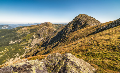 Fototapeta na wymiar Mountain Landscape. Mount Chopok with Tourists and Mount Dumbier in Background. Low Tatras, Slovakia. View Towards East.