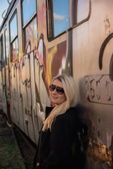 Young sexy girl with train and grafity
