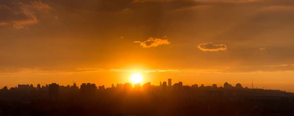 Panoramic view of the big city silhouette against the backdrop of incredibly, awesome bright, colored sunset. Kyiv. Ukraine.