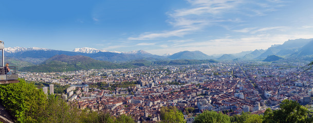 View of the City of Grenoble and the Alps from the observation deck fanikular. Panorama with dramatic city and the snow-capped Alps, the 4 frames.