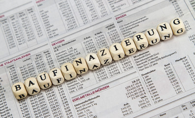 Fototapeta premium property financing word built with letter cubes