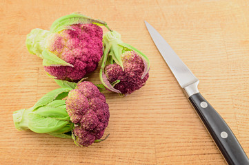 Purple cauliflower and knife