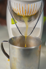 Closeup on squeezing healthy orange juice mix