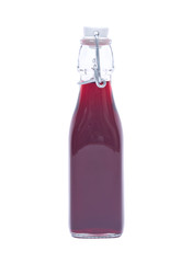 Homemade raspberry liqueur in clear glass bottle with swing top isolated on white background