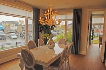 A dining room with large windows.