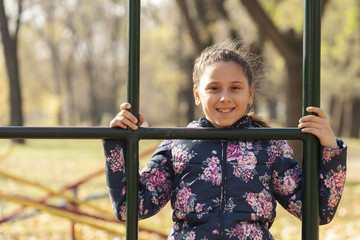 Fototapeta premium The girl playing on the playground