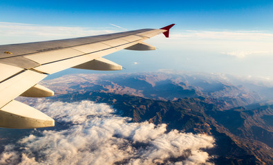 Fototapeta premium Looking through window aircraft during flight in wing with top view