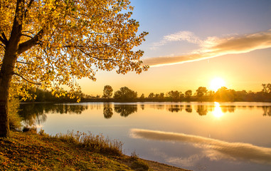 Romantic autumn sunset on the lake