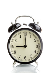 it's nine o'clock already, time to wake up for breakfast, vintage old black metallic alarm clock