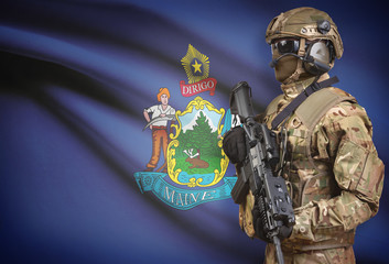 Soldier in helmet holding machine gun with USA state flag on background series - Maine