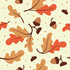 Seamless pattern with orange oak leaves and acorns. © pravdinal