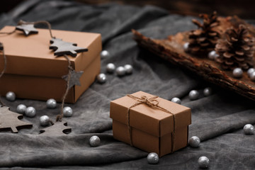 Christmas decoration and gift boxes over grey background.