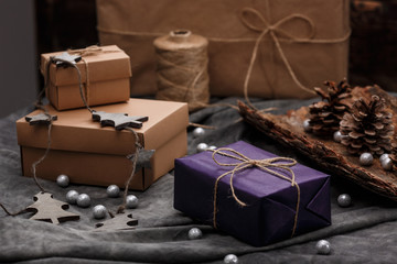 Christmas decoration and gift boxes over grey background.