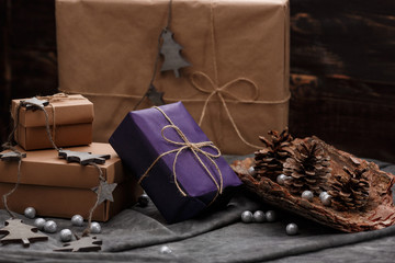 Christmas decoration and gift boxes over grey background.