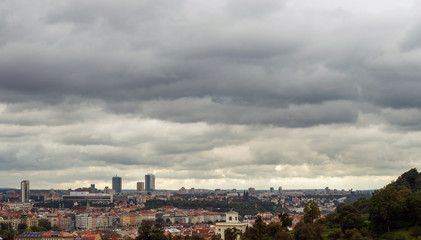 Cloudy nasty day in Prague. Red roofs in the city Prague
