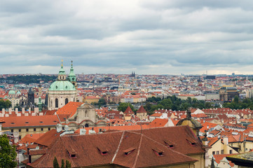 Fototapeta na wymiar Cloudy nasty day in Prague. Red roofs in the city Prague.
