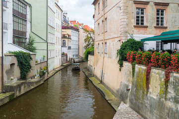 Fototapeta na wymiar View on the narrow channel in Prague