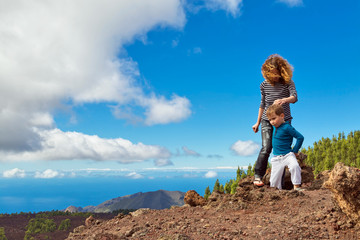 Fototapeta premium Mother and son at top of mountain