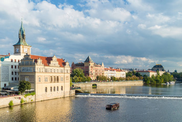 Fototapeta premium Small old tour travel boat passing Vltava river