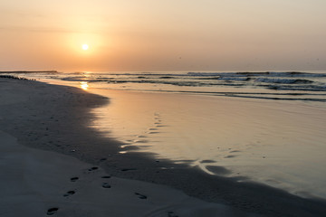 Fototapeta na wymiar Amazing Sunset red waves at beach Salalah Oman 10
