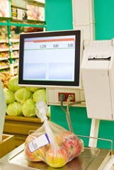 electronic scales in the supermarket vegetable and fruit department 