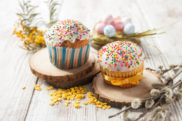 Easter cakes and eggs on a table, selective focus