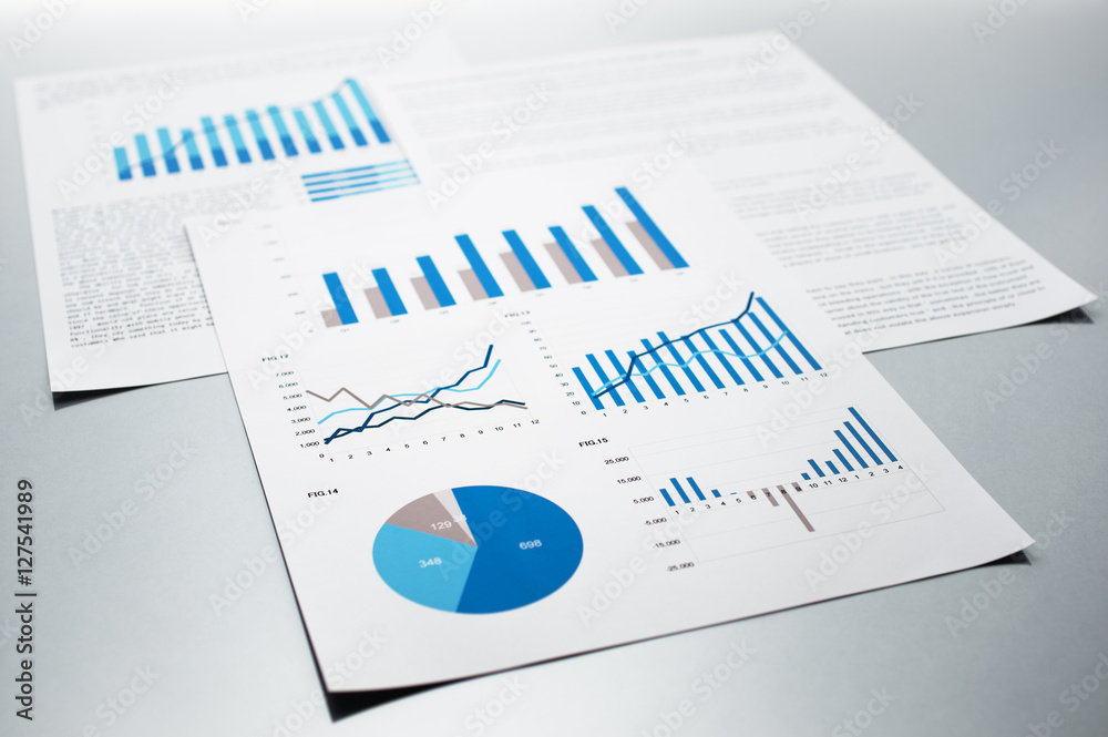 Poster business reports. graphs and charts. documents on gray reflection background.