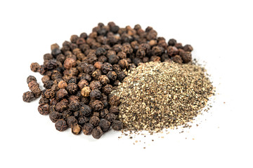Black peppercorns and ground pepper isolated on white background