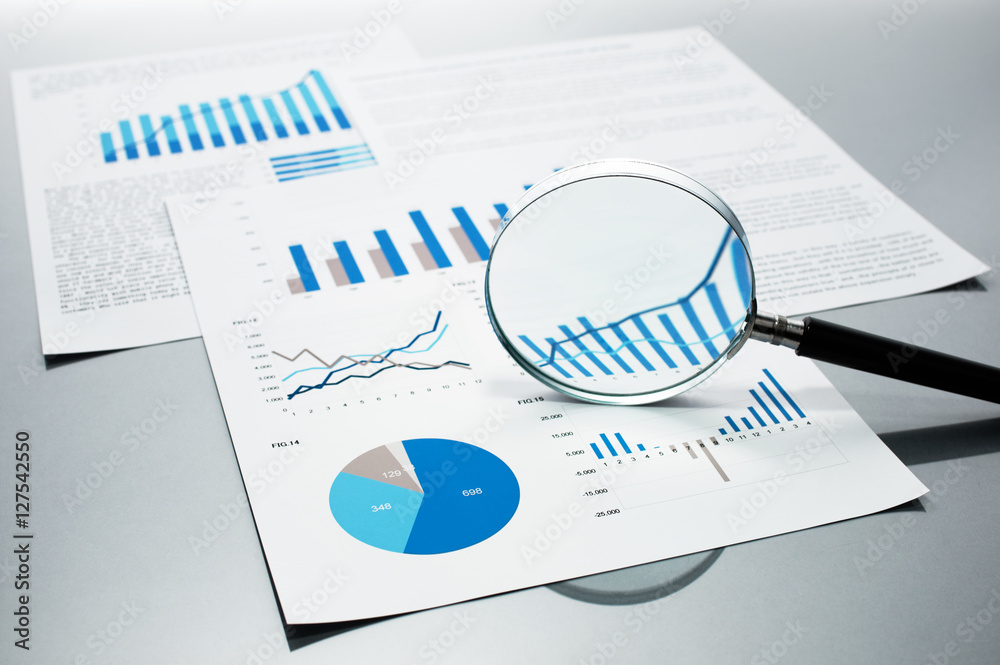 Poster Checking financial reports. Graphs and charts.　Documents and magnifying glass on gray reflection background.
