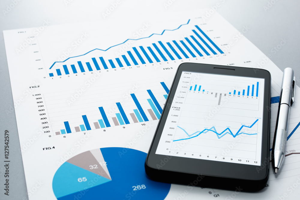 Poster Business document, smart phone and pen on gray reflection background.
Many graphs and charts. Concept image of data gathering.
