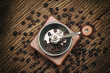 Fototapeta na wymiar Vintage manual coffee grinder with coffee bean
