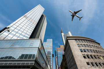 Fototapeta na wymiar Frankfurt skyscrapers buildings and a plane flying overhead