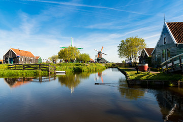 Fototapeta premium Traditional Dutch windmills and houses in Zaanse schans, Netherlands.