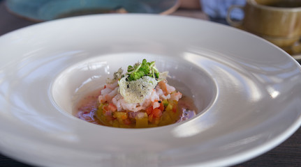 Salad with peppers, shrimp and seedlings. Delicious and healthy salad with seafood. Food from the restaurant.