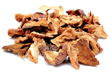 Heap of dried mushrooms on white background