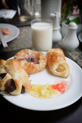 dessert baked or fruit bread on white dish.