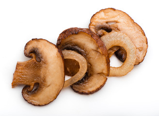Roasted sliced champignons with onions isolated on white background. Mushrooms. Top view.