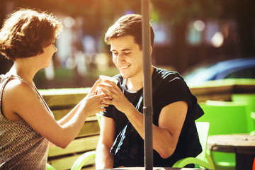 couple sitting in a cafe outside