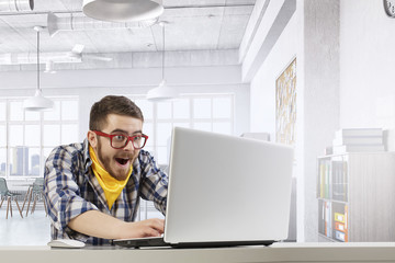 Hipster guy use laptop . Mixed media