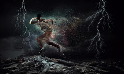 B-boy performing some moves . Mixed media